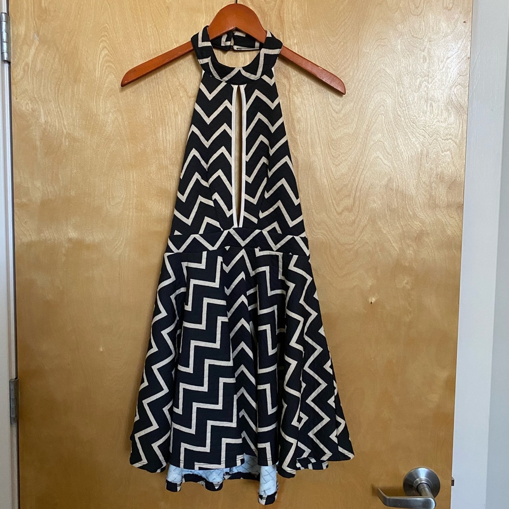 Backless mini-dress with chevron pattern.